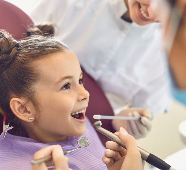 Little girl getting a dental checkup