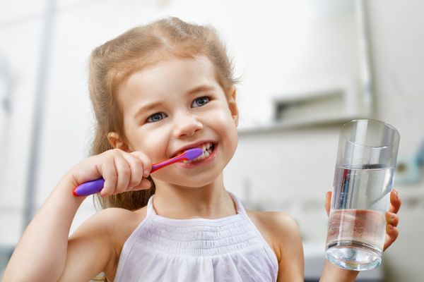 Girl Brushing Teeth